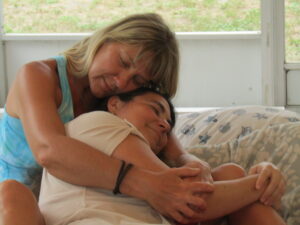 image of Niki cuddling with a woman